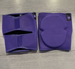 Purple solid knee pads with centered grip strip on back 