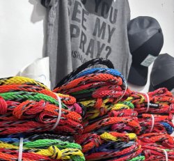 Various T-shirts and hats